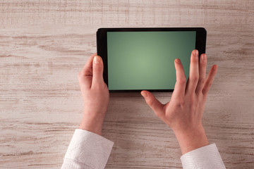 Business hands holding tablet