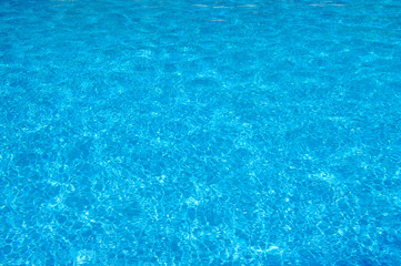Swimming pool blue water surface texture
