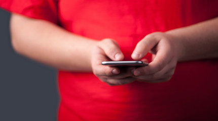 Young man holding smarthphone in hand