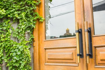 Detail of Modern style handle on wooden door