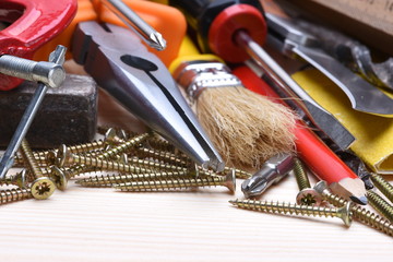 Set of working tools on wooden board