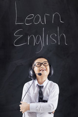 Student learns English with headphones