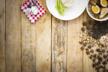 Thai food Kai-Pa-lo with rice dish and spices on wooden background.