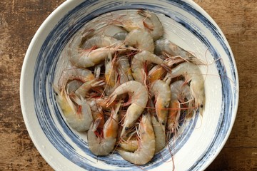 Top view of raw prawns in a bowl 