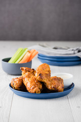 Buffalo chicken wings with celery carrot sticks