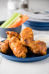 Buffalo chicken wings with celery carrot sticks
