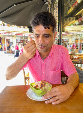 Indian Man Eating Pudding In Istanbul