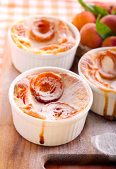 Apricot puddings in ramekins