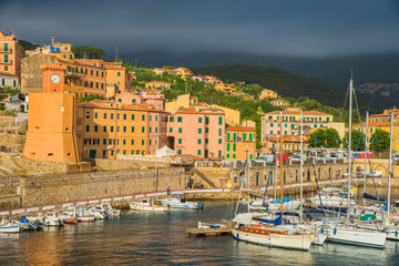 Beautiful panoramic view over Rio Marina traditional architecture, illuminated by sunset light in Elba island, Italy