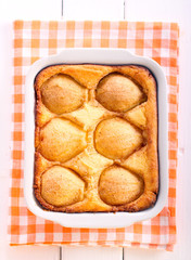 Pear spicy cheese cake in baking tin