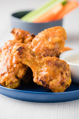 Buffalo chicken wings with celery carrot sticks