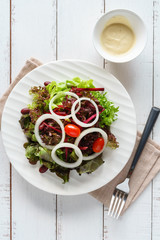 fresh hydroponic salad on white wooden table