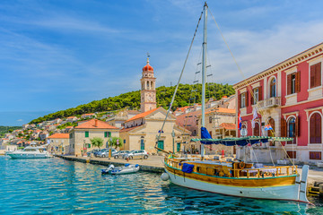 Pucisca town coastline cityscape. / Pucisca is small mediterranean town on Island of Brac, touristic destination in Croatia, Europe. - obrazy, fototapety, plakaty