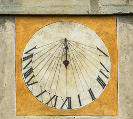 Fototapeta na wymiar Close-up of a Sundial on an old stone building