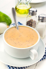 Vertical shoot of vegetables bowl cream on wooden