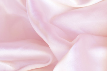 Smooth elegant pink silk, satin fabric background texture