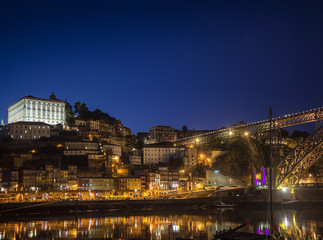 Fototapeta na wymiar porto old town and landmark bridge in portugal at night