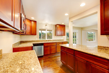 Nice wooden kitchen room interior with granite counter tops