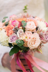 bridal bouquet of pink color in hands