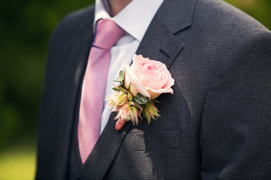 Groom's Buttonhole From A Pink Rose And A Tie