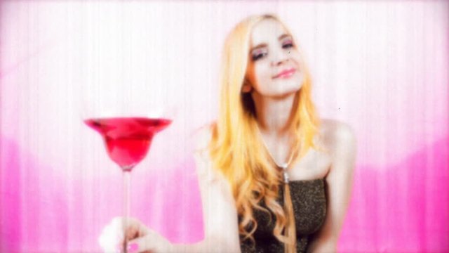 beautiful female enjoying a cocktail