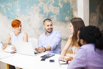 Young people working in the grunge office