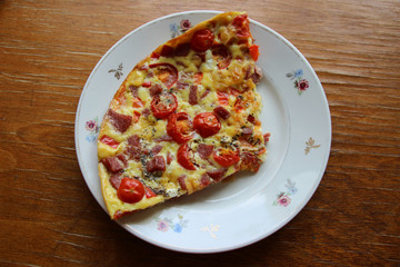 Scrambled eggs with red pepper,tomatoes,sausage.