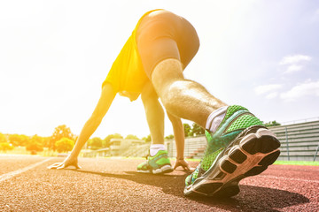 Runner training on athletic running track 