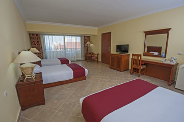 Interior of a luxury hotel room with balcony
