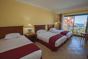 Fototapeta na wymiar Interior of a luxury hotel room with balcony