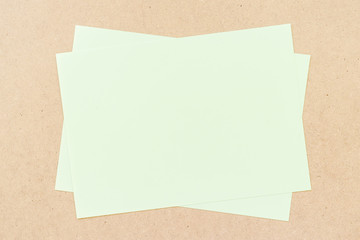 Office table with green paper sheets