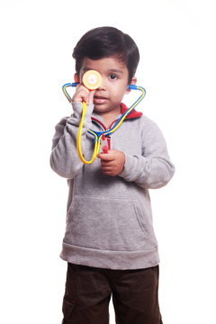 Indian Boy Playing Doctor With A Stethoscope