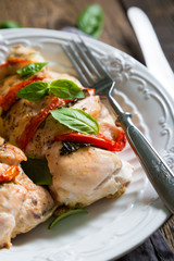 Baked chicken breast with mozzarella and cherry tomatoes with basil