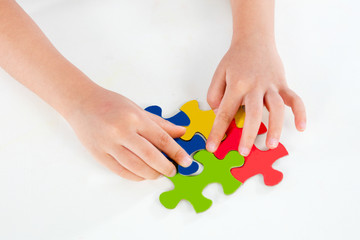 Child Playing Colorful Puzzle
