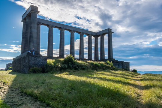 Edinburgh, Scotland - Jul 1, 2014 : People are spending their holiday around the National Monument on the Calton Hill on the sunny day, at Edinburgh city, Scotland.
