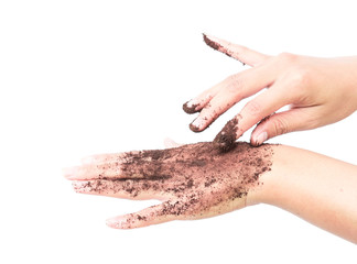 Woman's hand with scrub coffee grounds on skin hand, beauty and healthy care concept