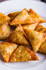 Chicken samosas deep fried.