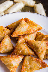 Chicken samosas deep fried.