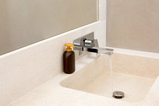 batroom sink with running water