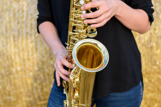 Close up on a shiny brass tenor saxophone