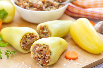 Uncooked peppers stuffed with meat, rice and vegetable