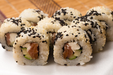 rolls with salmon and white and black sesame