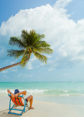 Man relaxing on beach, ocean view, Maldives