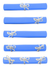 Blue paper rolls tied with handmade cords and bows isolated