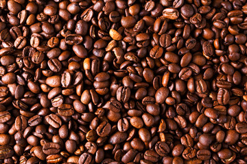 brown roasted coffee beans close up background, texture