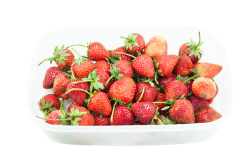 Strawberries in a plastic box, Isolated over white