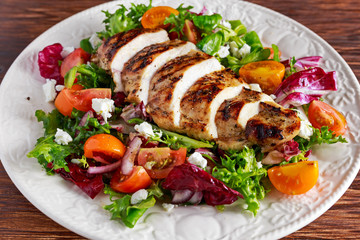 Grilled Chicken Breast fillet with fresh tomatoes vegetables salad. concept healthy food.