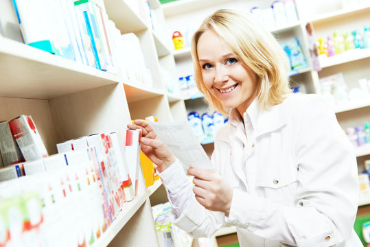 Pharmacy chemist woman in drugstore