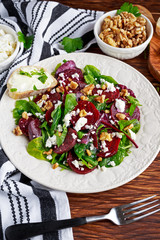 Healthy Beet Salad with fresh sweet baby spinach, kale lettuce, nuts, feta cheese and toast  melted 