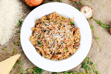 Risotto mushrooms with parmesan cheese, fresh herbs, rice, onion.